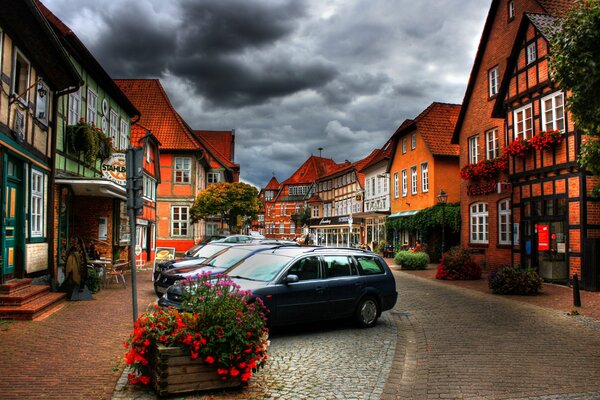 A street with clouds with parked cars clouds at home a beautiful view of the sky