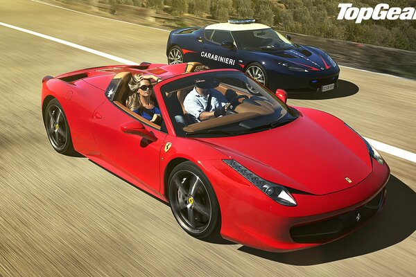 Two sports cars, red and blue, are driving on the road. Advertising the transfer in the upper corner