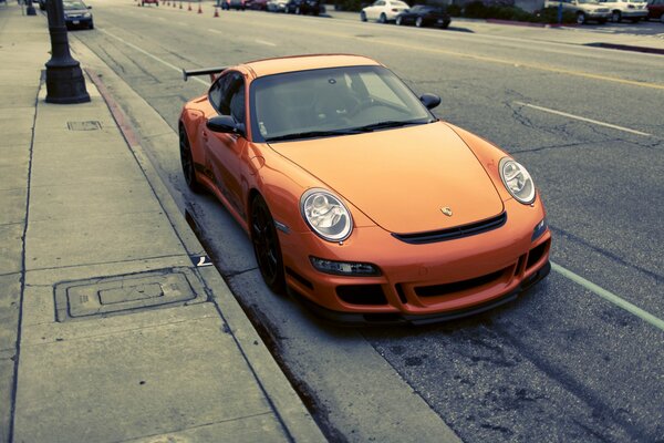 A porshe gt3 rs car parked at the curb