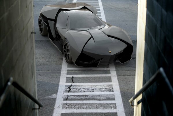 A black sports car near the entrance