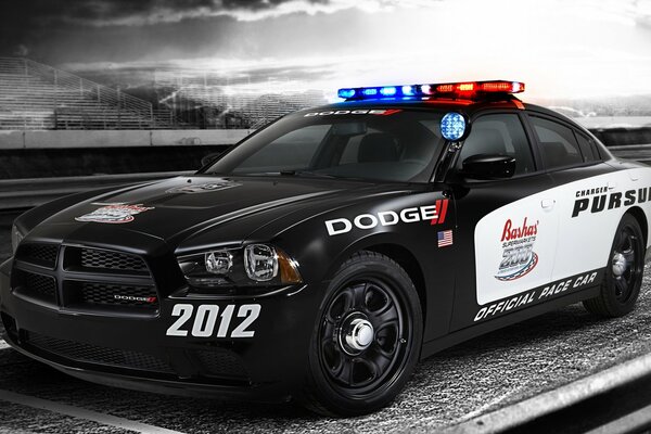 A car on a black and white background of empty stands