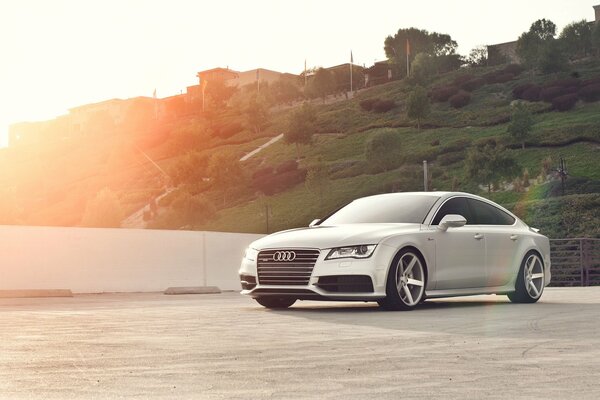 AUDI car on the background of green hills