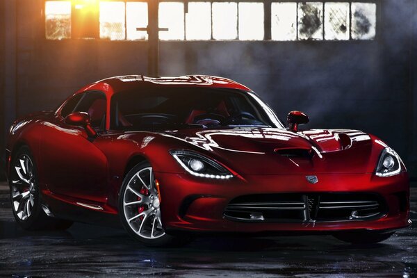 Red Dodge Viper on the background of sunlight