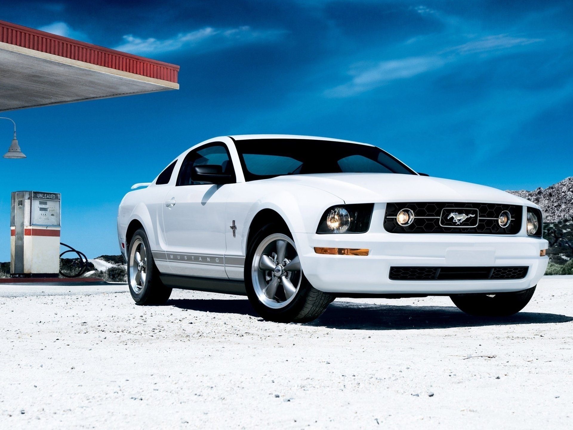 ford mustang coupe front white dressing sky