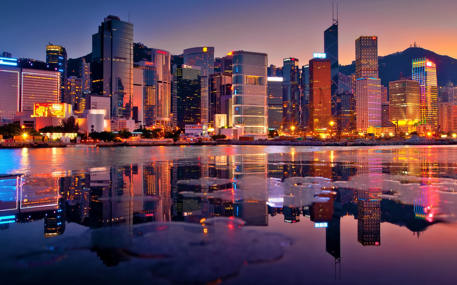 hong kong noche bahía rascacielos puesta de sol luces edificios