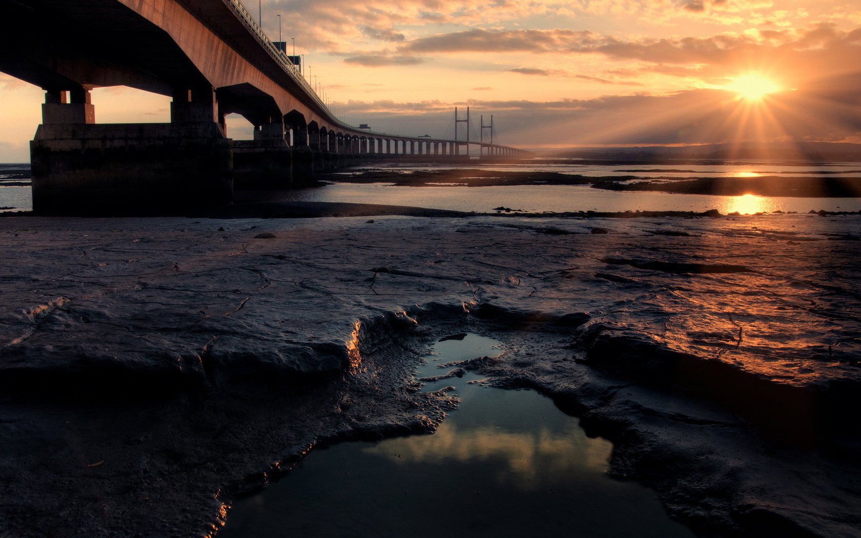 bridge shore sea the ocean the sun stone