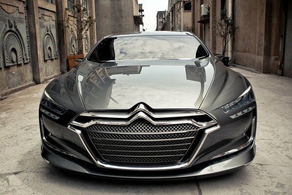 French grey citroen on a narrow street background