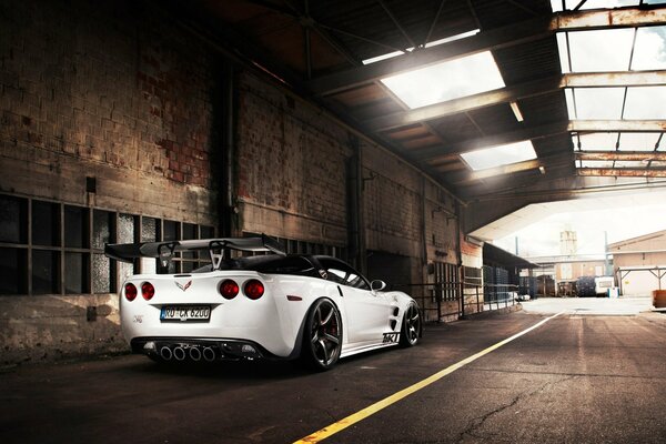 Three-seat White Chevrolet Corvette