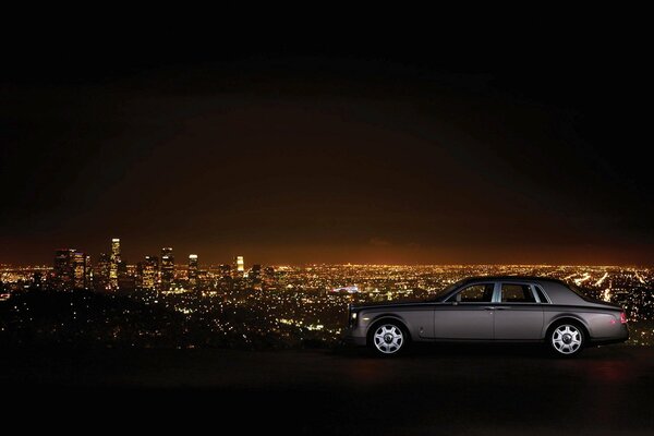 Rolls Royce with a night city landscape