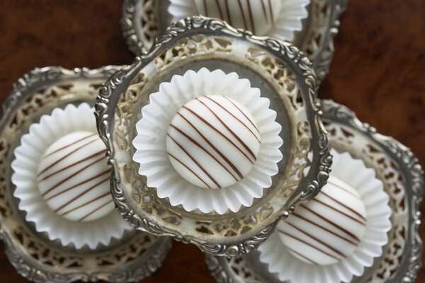 A cake on the table in a silver dish