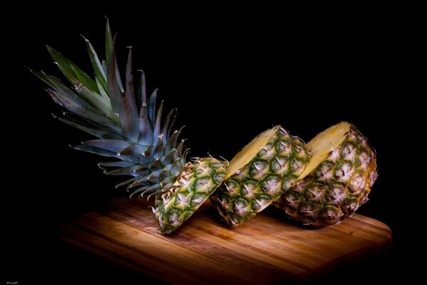 Juicy pineapple on a wooden board