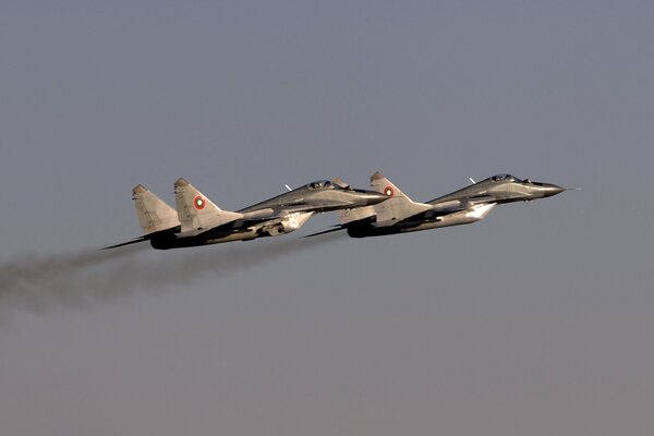 The mig-29 fighter is flying in the sky