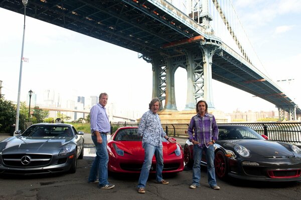 Men on the background of cars under the bridge