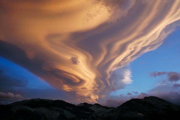 Clouds and hills. Unusual sky