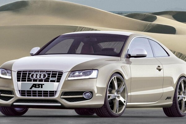 Beige audi as5 on a desert background