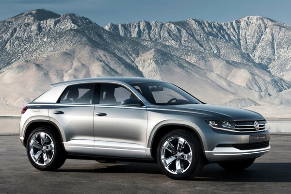 Volkswagen cross coupe on a winter mountain landscape