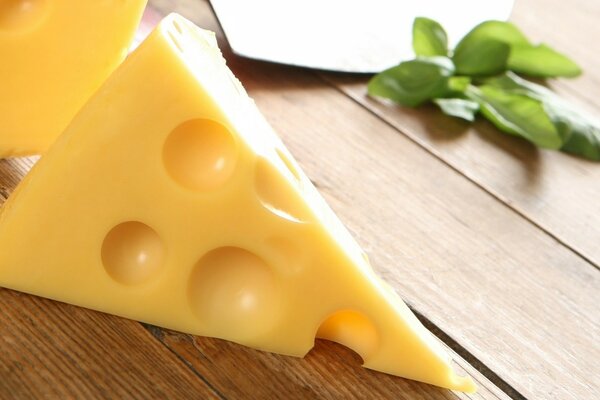 A piece of cheese with big holes