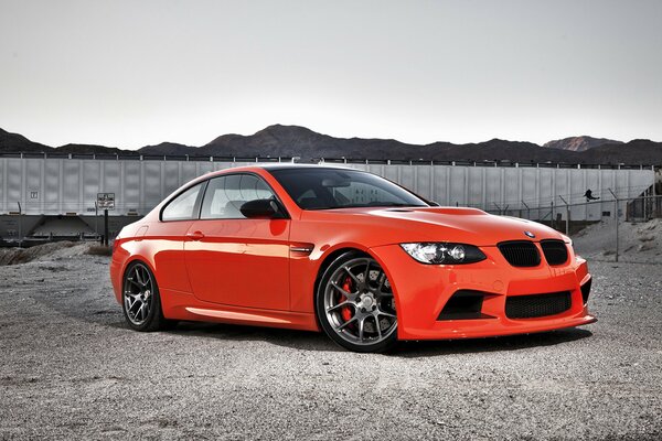 Red tuning BMW on a gravel road