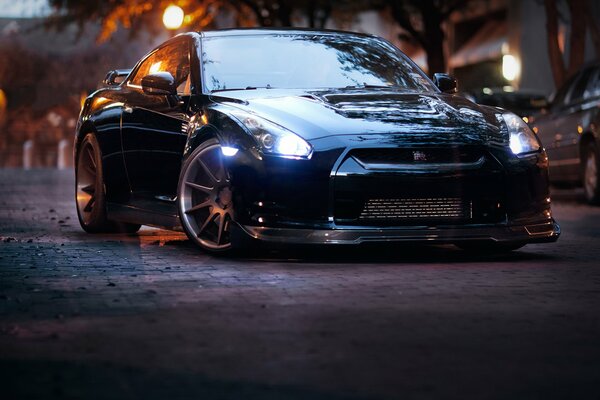 Dark blue Nissan GTR tuned wheels on the street