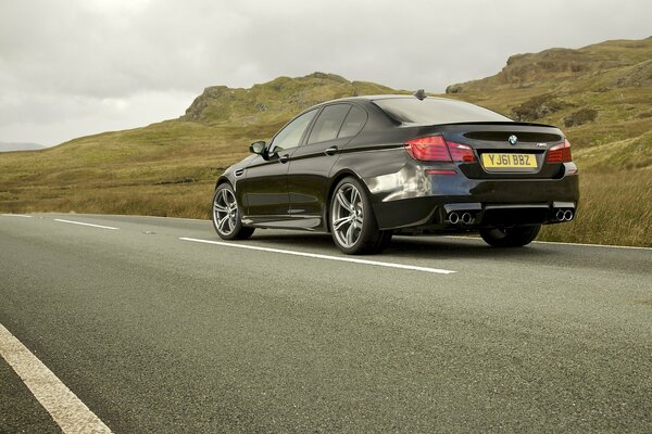 Photo wallpaper black sedan car on the road