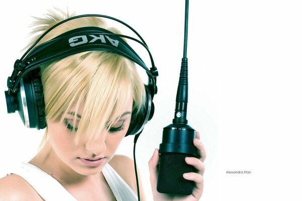 A girl with headphones and a microphone