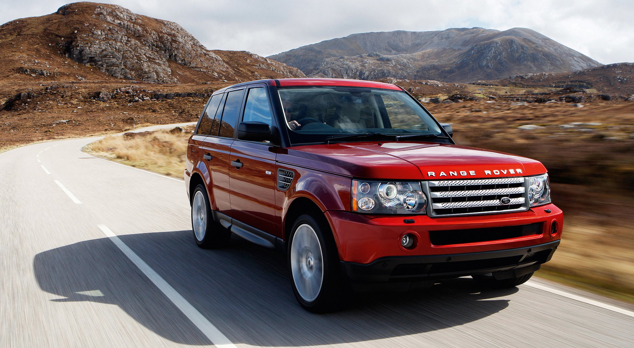 red land rover mountain