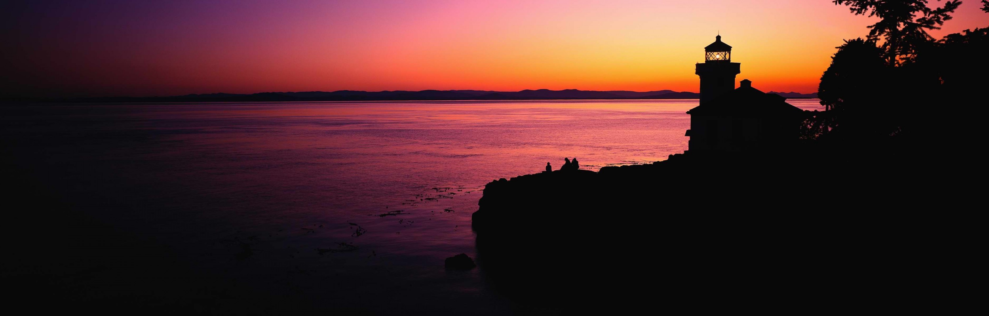 faro puesta de sol mar