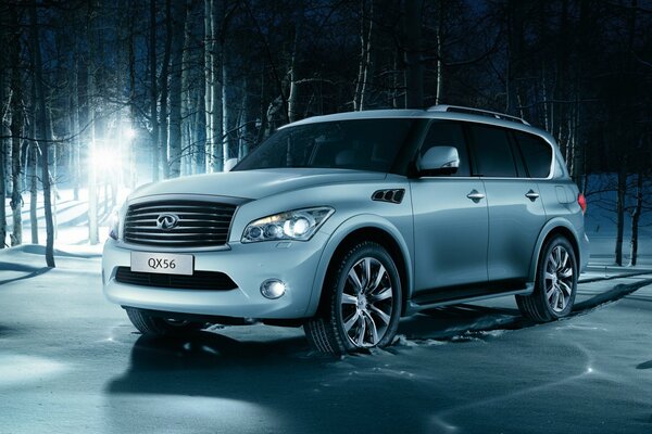 Luxury Infiniti SUV in the winter forest