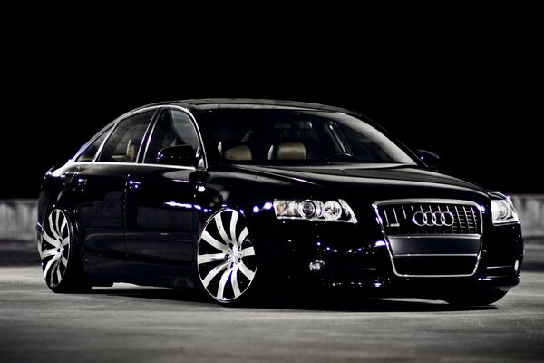 Black audi a6 on asphalt at night