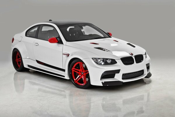 White bmw gtrs3 with red wheels