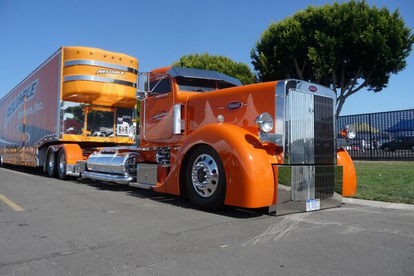 Orange peterbilt truck with orange cab