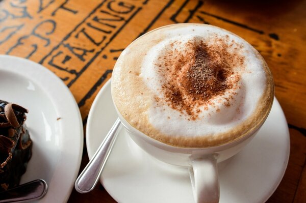 A cup of coffee with milk and foam