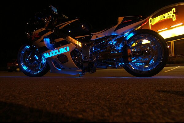 Bright colorful motorcycle in the neon rays