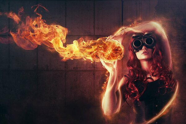 Рыжая девушка в очках держит огонь