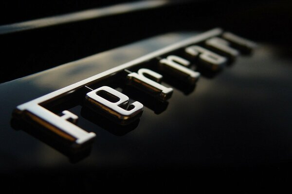 The inscription ferrari. Stylish logo