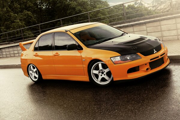 Yellow car with tuning on the road