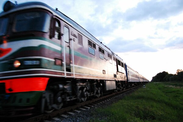 Photo of a passing train in the evening