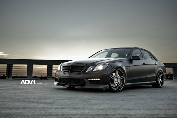 Black matte Mercedes in the sunset of the dream