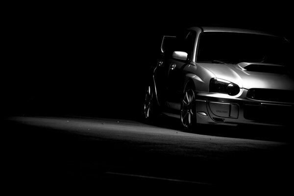 Black and white background with subaru car