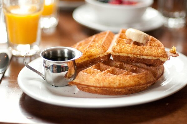 Soft waffles with chocolate on a plate