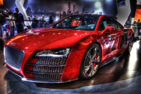 Exhibition photo of a red sports audi r8