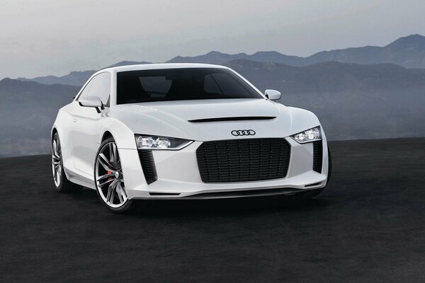 Audi quattro on a landscape background of mountains