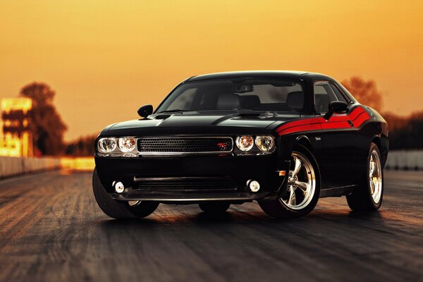 Black sports car with red stripes