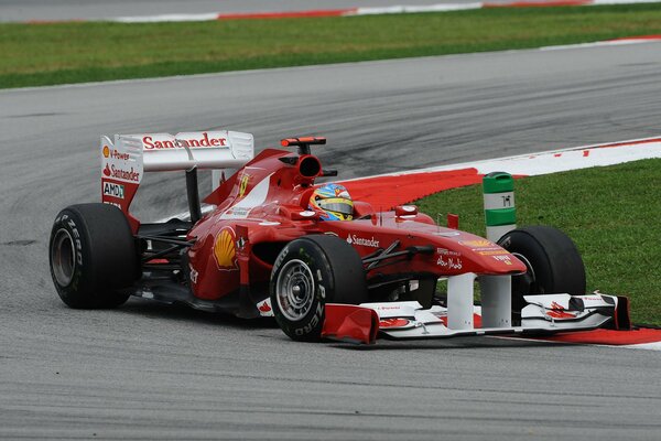 The driver Fernando Alonso in the car in Formula 1