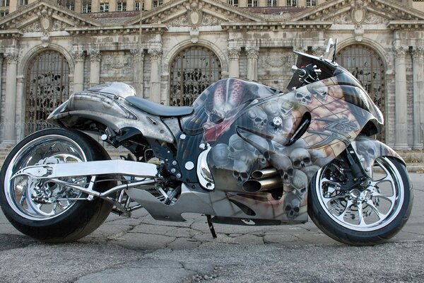 Motorcycle with unusual airbrushing on the background of architecture