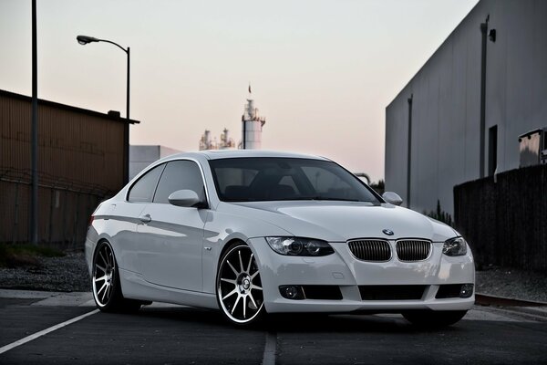 Elegant white BMW at sunset