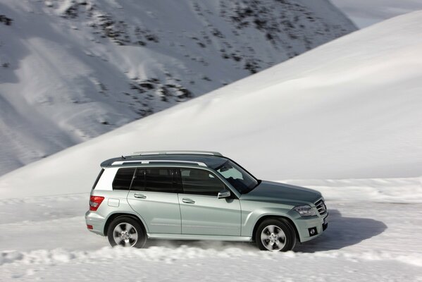 Mercedes on a mountain road in winter