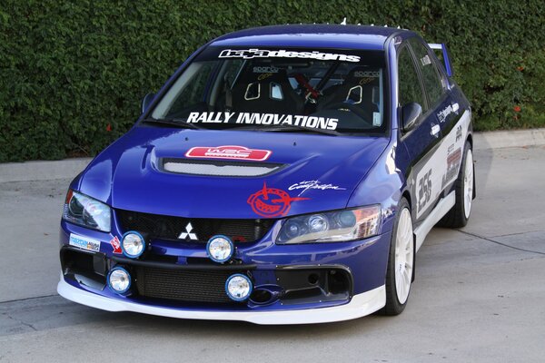 Blue Mitsubishi with professional stickers