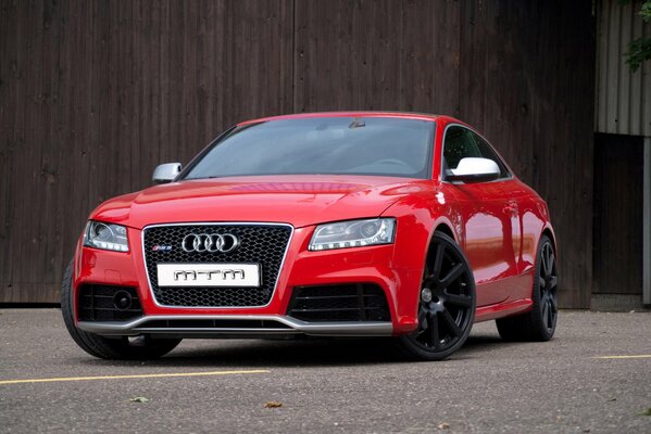 Red audi car with black wheels