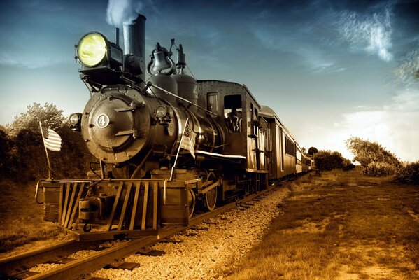 Retro steam locomotive rides on the tracks photo